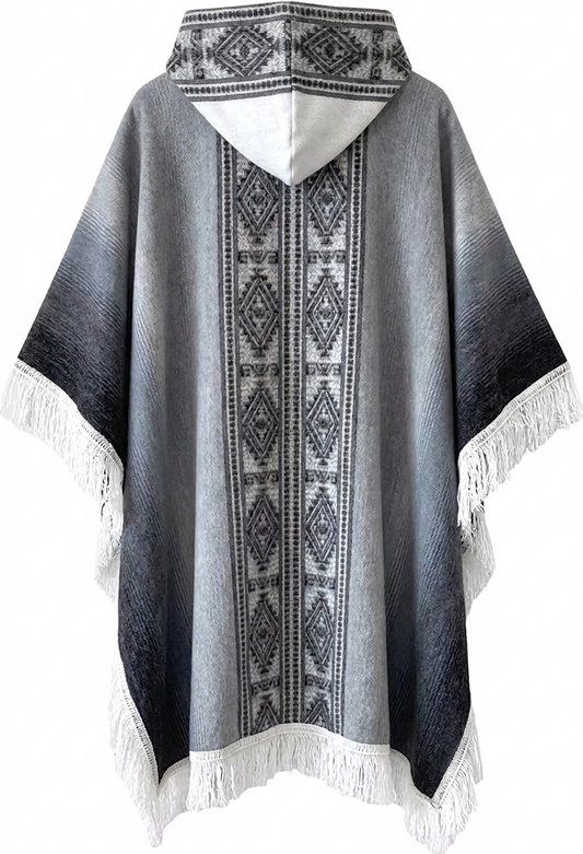 Gray poncho with black and white patterned border and fringe on a white background